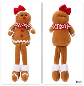 Front and back views of gingerbread man plush with red bow and striped collar