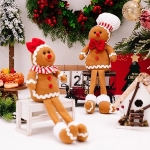 Detailed plush gingerbread man dolls with chef hat and red bow Christmas decor