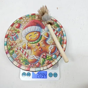 Detailed weight measurement of Christmas gingerbread drum decoration and brush on a digital scale