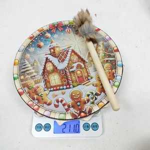 Detailed view of a Christmas gingerbread shaman drum weighing 211 grams on a digital scale