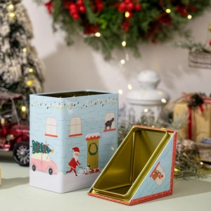 Blue Christmas tin house storage box with festive Santa Claus and reindeer illustrations