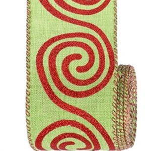 Close-up of light green Christmas ribbon with red glitter swirl patterns and stitched edges