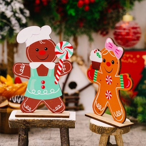 Christmas gingerbread man wooden tabletop decorations with chef hat and cupcake detail