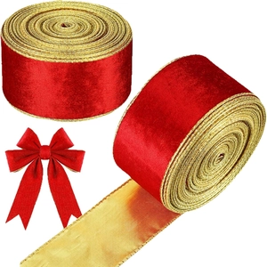 Red velvet ribbon with gold edges and a crafted bow for Christmas gift wrapping and decor