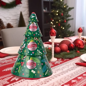 Detailed view of 3-tier Christmas tree tin cans on a red festive tablecloth