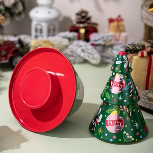 Christmas tree shaped tinplate candy box with festive Merry Christmas patterns in green