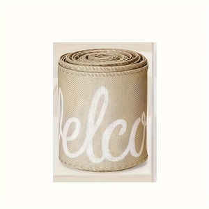 Close-up of farmhouse welcome ribbon with beige texture and white cursive script