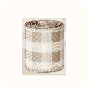 Detail of buffalo plaid craft ribbon roll with woven edges for DIY home decor