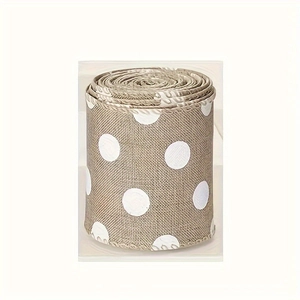 Close-up of rustic brown burlap ribbon with white polka dot pattern for DIY decor