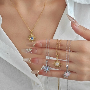 Elegant sunburst flower necklaces with opal center stones in gold and silver finishes