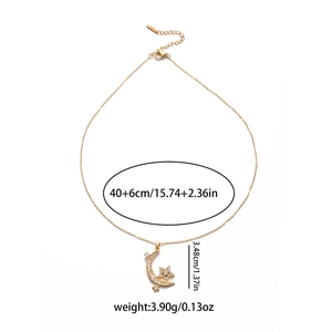 Minimalist gold star moon necklace with white zircon pendants on a white background