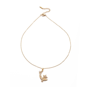 Star and moon gold pendant necklace with cubic zirconia inlays on white background