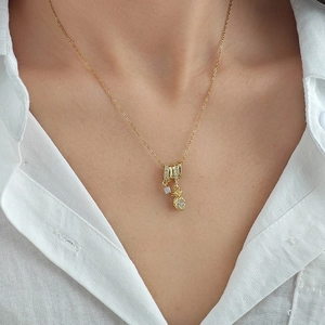 Elegant gold pineapple pendant necklace with sparkling crystals on a cross chain for women