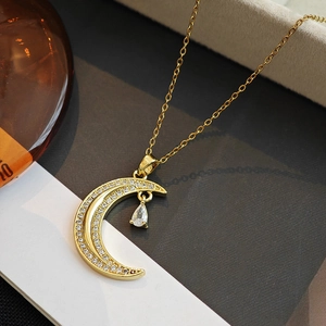 Elegant gold moon pendant necklace with micro-paved crystals and teardrop gemstone charm
