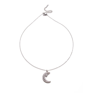 Macro view of moon pendant necklace with micro-paved crystals and teardrop charm detail