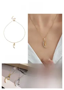 Detail showing elegant star and moon pendants with delicate crystal inlays on necklace
