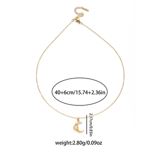 Detailed view of crescent moon necklace with blue zircon and size specifications