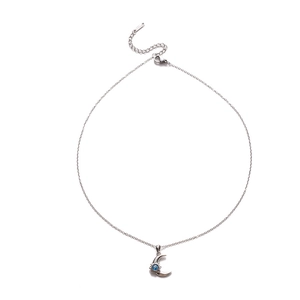 Detailed view of silver moon necklace with blue zircon, lobster clasp and extension chain