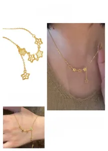 Macro view of gold star tassel necklace featuring hollow star pendants and fine chain details