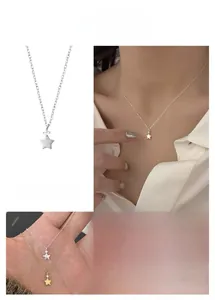 Detail of star pendant necklace featuring white zircon inlay in gold and silver options