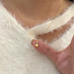 Elegant gold star pendant necklace with zircon stone on a fine chain for women