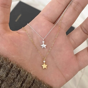 Gold and silver star pendant necklaces with matte finish and zircon accent
