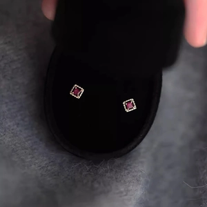 Elegant gold square stud earrings with deep red zircon and vintage milgrain detailing