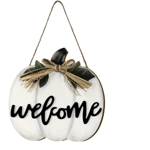 White pumpkin welcome sign with green leaves and burlap bow for fall front door decor