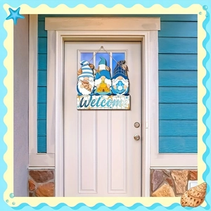 Coastal wooden welcome sign with three beach gnomes and nautical star ornaments for doors