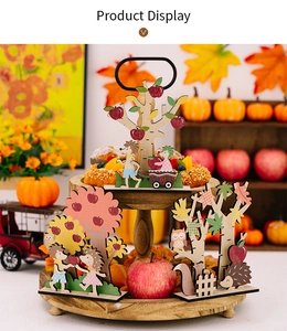 Detail of wooden autumn decor set featuring hedgehogs and pumpkins on a tiered tray