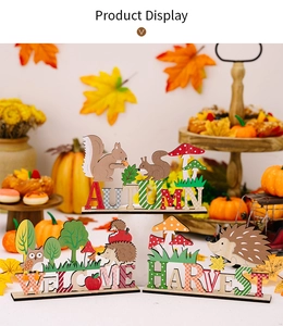 Close-up of wooden autumn table signs featuring squirrel, hedgehog and owl motifs