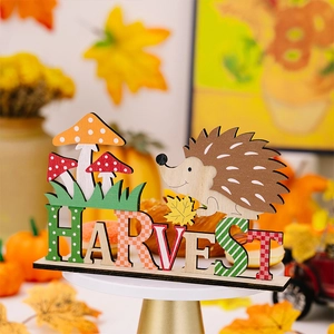 Macro detail of wood Harvest sign decoration with hedgehog and colorful mushrooms