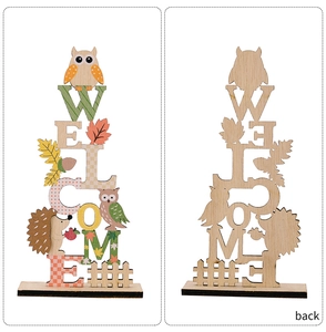 Close-up of wooden Welcome sign with owl and hedgehog showing front and back views