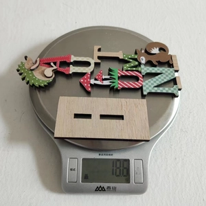 Macro weight shot of wooden forest animal decor featuring hedgehog and squirrel patterns