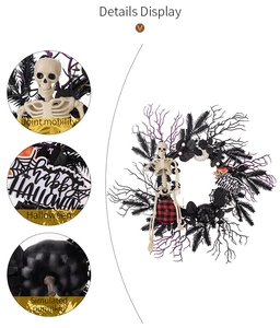 Detail view of Halloween wreath with movable skeleton joints and simulated pumpkins