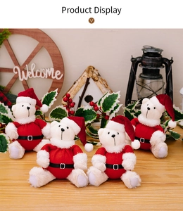 Detail of four plush Christmas bears in Santa outfits with holiday festive decor