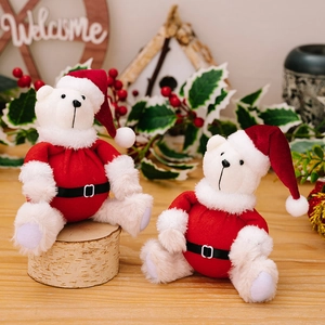 Cute Christmas teddy bear plush figures in red Santa outfits on a wooden display stand