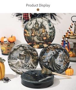 Detail of four Halloween drums featuring 3D embossed designs of witches and black cats