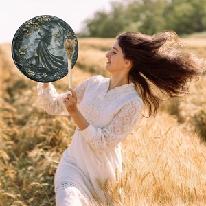 Detail of Shaman drum with goddess relief held in golden wheat field for Halloween decor