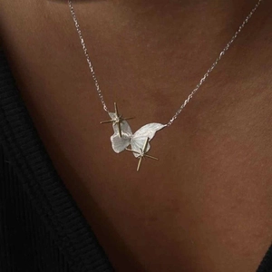 French style purple butterfly and star necklace in silver finish worn by a model