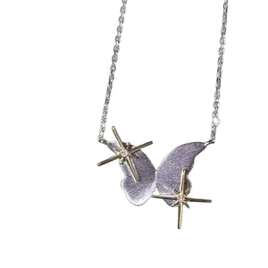 Elegant butterfly pendant necklace with golden star accents and crystal on silver chain