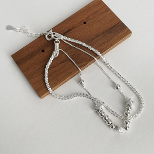 Three-layer silver star charm bracelet with round beads and adjustable lobster clasp
