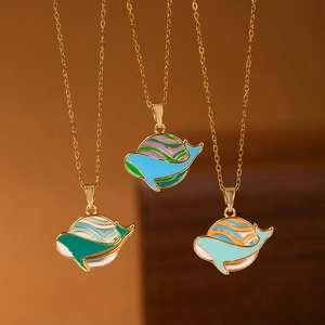 Three dainty whale tail pendant necklaces with gold plating and colorful enamel finish