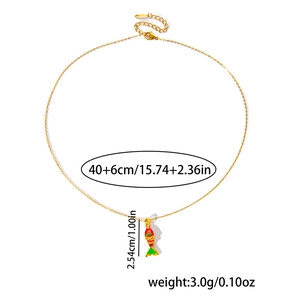Detail of gold fish necklace with colorful enamel pendant and lobster clasp closure