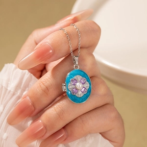 Vintage oval locket necklace with blue enamel flower and pearl on silver chain
