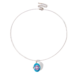 Detail of vintage oval flower locket pendant with turquoise and small pearls