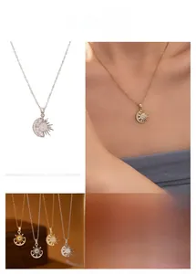 Détail du collier pendentif soleil et lune orné de cristaux en finitions or et argent