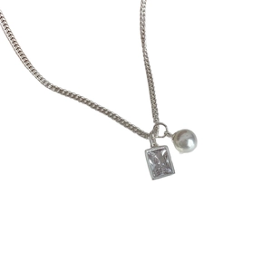 Elegant silver necklace with a rectangular cubic zirconia pendant and a round white pearl