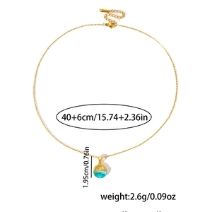 Detailed view of gold fishtail necklace with star and moon pendant dimensions