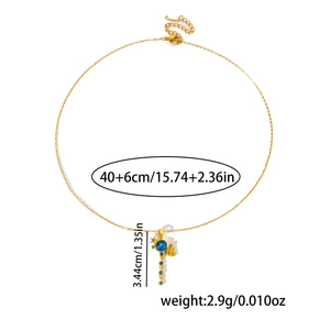 Detail view of gold necklace showing blue stone pendant and precise size measurements